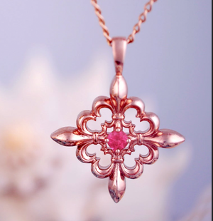 fleurdelis pendant in Rose gold wih ruby