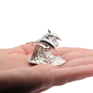 Dolphins on waive silver collectible art sculpture