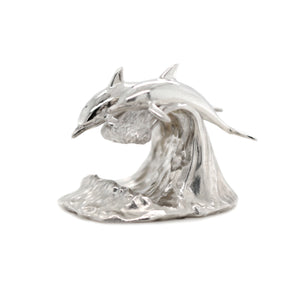 Silver Sculpture of Dolphins on a waive for Collector