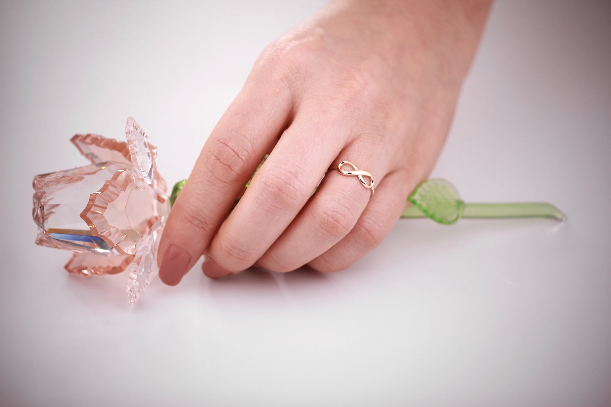 Infinity Ring in 14K Gold lifestyle view on model hand