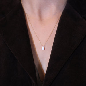 Opal necklace teardrop pendant on model neckline