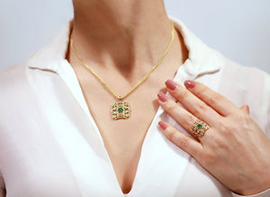 Gold emerald diamond ring and emerald diamond pendant set