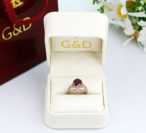gold garnet engagement ring with diamonds in gold