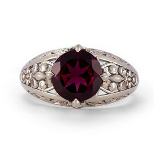 solid white gold vintage engagement ring with diamonds and garnet