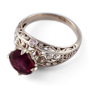 white gold vintage engagement ring with diamonds and garnet