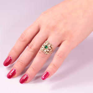 statement emerald ring with diamonds in solid yellow gold