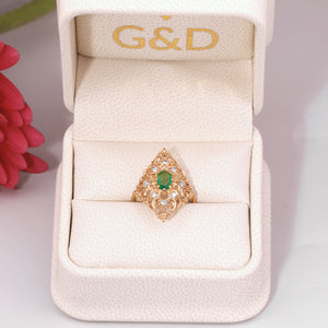 Emerald ring with diamonds in a gift box